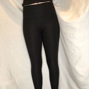 Spaulding black leggings with mesh on bottom on the back